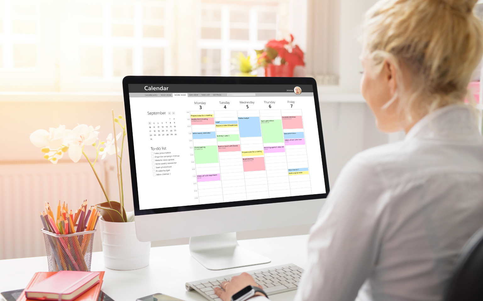Attorney looking at court reporting schedule on desktop computer