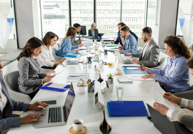 Group of legal professionals sitting at conference table