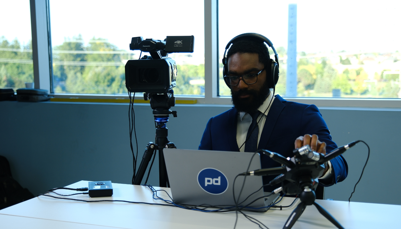 Planet Depos legal videographer recording a video deposition